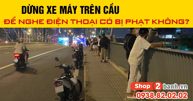 Năm 2025 dừng xe máy trên cầu để nghe điện thoại có bị phạt không - 1